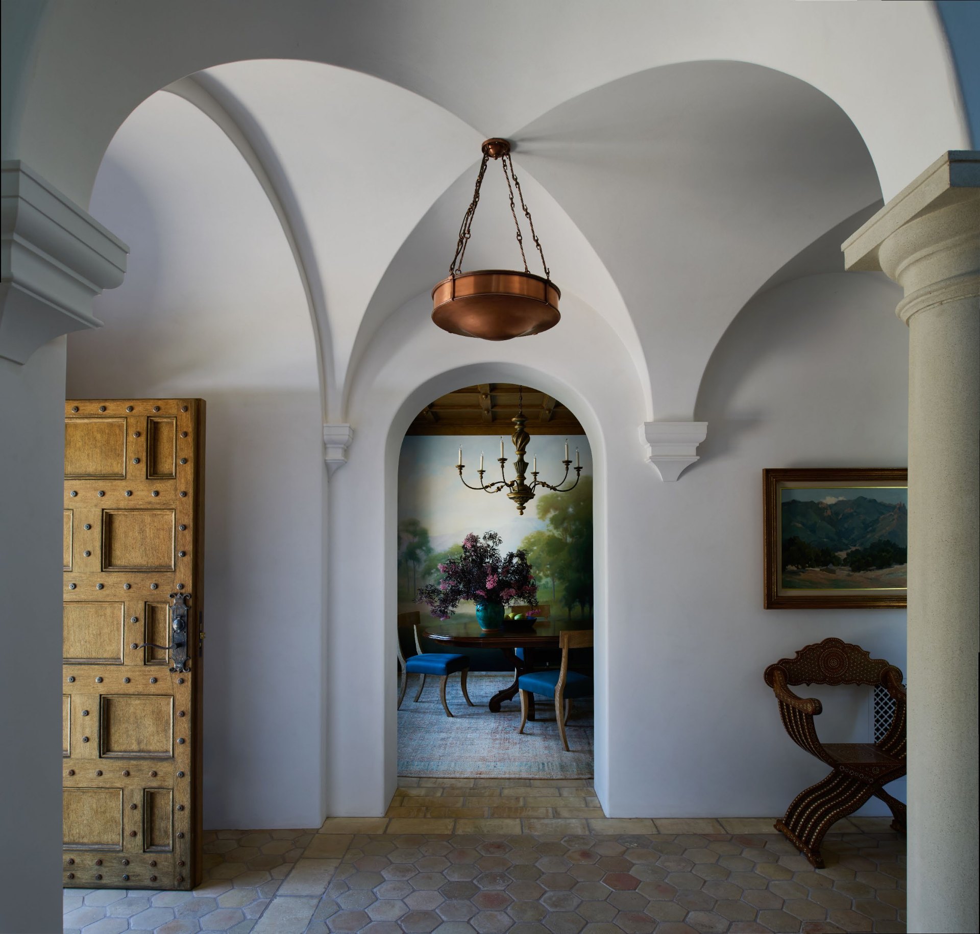Vaulted entryway with antique door